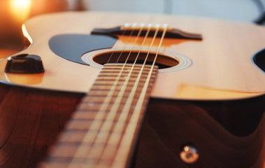 Photography classical guitar on a light brown background