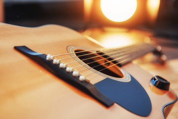 Fototapeta premium detail of classic guitar with shallow depth of field