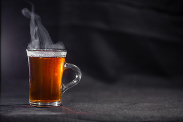 the Cup of tea on a dark background.