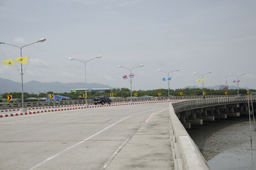 Thai people driving car on bridge highway beach road beside the sea go to Bangsaen Beach