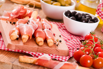 Grissini breadsticks with ham. 