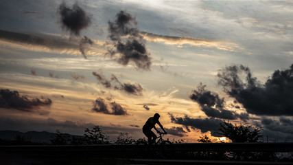 Fototapeta na wymiar silhouette, people spinning bicycles