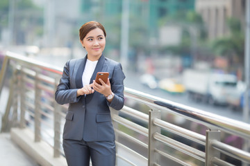 Businesswoman use smartphone and has positive thinking