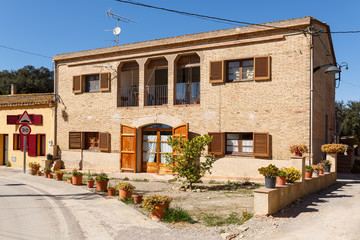 Fototapeta na wymiar View of the old rural house. Village Sant-Esteve-de-Guialbes (San Esteban de Guialbes), province Girona, Spain