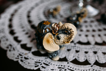 Elephant statuette holds wedding rings
