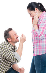 Handsome young man doing an engagement proposal