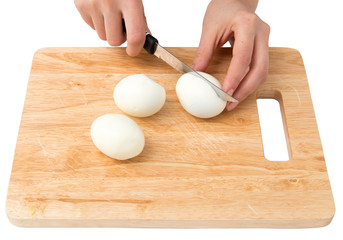Fototapeta na wymiar cook eggs on cutting board on a white background