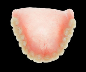 false teeth on a black background