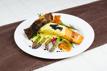 Salmon Fillet With Sauce With Asparagus On White Plate