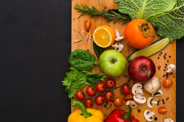 Frame of fresh vegetables on wooden background with copy space