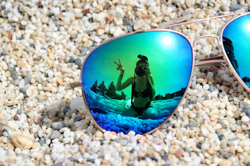 reflection in the glasses