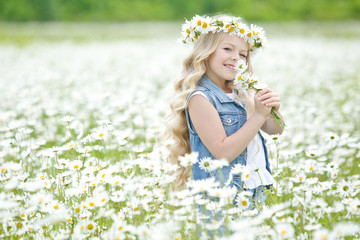 Girl in a field with flowers 