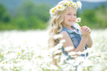 Girl in a field with flowers 