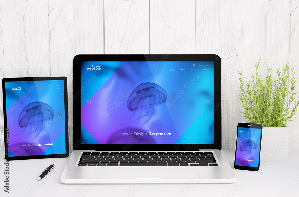 Poster devices on table with cool responsive design website