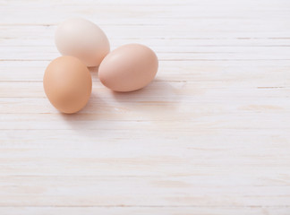 eggs on white wooden background