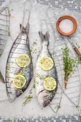 Fresh whole sea bream with lemon and herbs