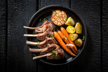 Tasty roasted lamb ribs with garlic and vegetables