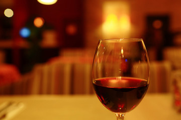 Serving a glass of red wine in a restaurant