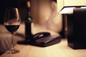 Serving a glass of red wine in a restaurant