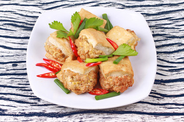 Fried gold bar as spicy fried tofu wrap minced pork .