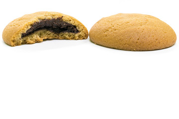 pile of stuffed chocolate cookies on white background.
Delicious and Tasty Chocolate Cookie - close up shot.