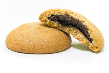 pile of stuffed chocolate cookies on white background.
Delicious and Tasty Chocolate Cookie - close up shot.
