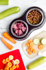 organic pets food with zucchini and carrot on table background top view