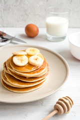 cooked pancake on plate at wooden background