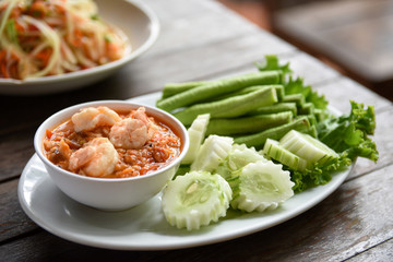 pimp chili paste or Chili paste Thai style with steamed and fresh vegetables