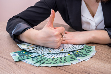 Woman holding 100 euro bills. money concept.
