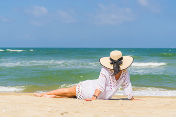 Fototapeta na wymiar Woman relaxing at the beach in Hoi An