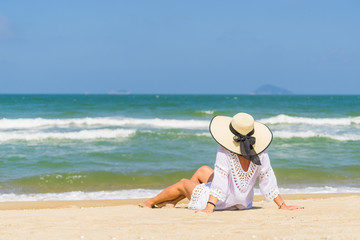 Fototapeta na wymiar Woman relaxing at the beach in Hoi An