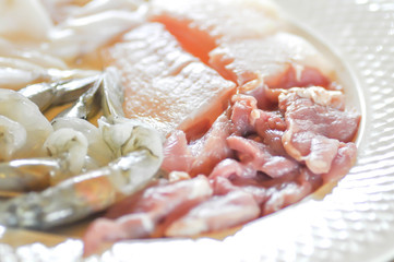 raw fish, raw pork and  raw shrimp