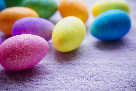 Colorful Easter Eggs on a fabric background. Creative concept