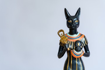 The Goddess Bastet - Role in ancient Egypt on gray background. 
Bastet was a goddess in ancient...