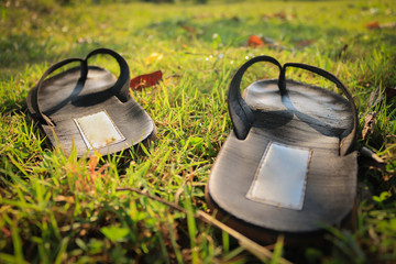 sandals on green grass