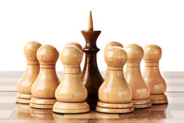 White and black chessmen on chessboard