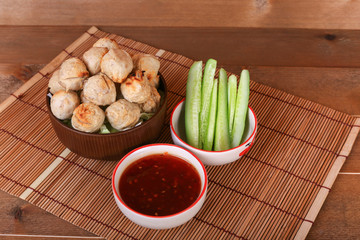 grilled meatball with spicy tamarind sauce  in bowl