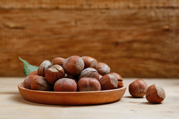 hazelnuts in wooden plate