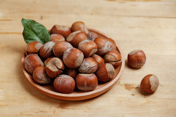 hazelnuts in wooden plate