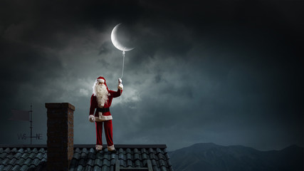 Fototapeta na wymiar Santa catch the moon . Mixed media