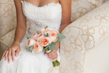 Bride holding rich marriage bouquet