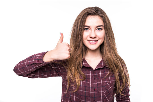 cheerful young girl in checkered shirt showing thumbs up