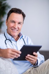 Portrait of doctor using digital tablet