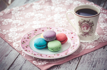 macaroon cookies on plate and coffe