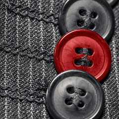 three black and red buttons 