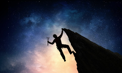 Obraz na płótnie Canvas Extreme climbing is his adrenaline . Mixed media