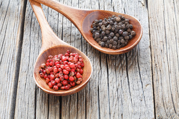 Colored pepper in a vintage wooden spoon