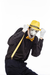 Portrait of a man, pantomime in confusion, showing that he is afraid. Isolated on white background.