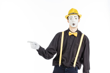 Portrait of a man, an artist, a pantomime. Shows something, isolated on white background